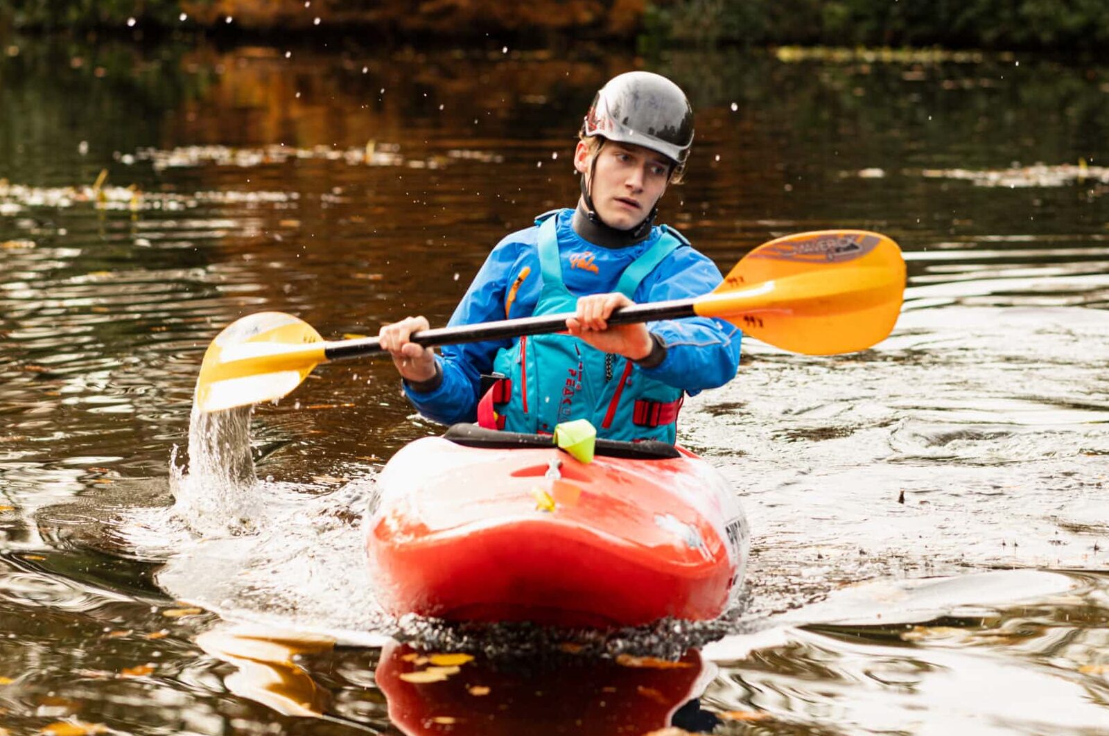 Student paddling in kayak
